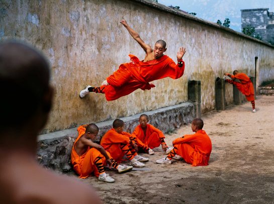 Monk running on wall