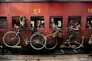 Bicycles on the side of a train in India