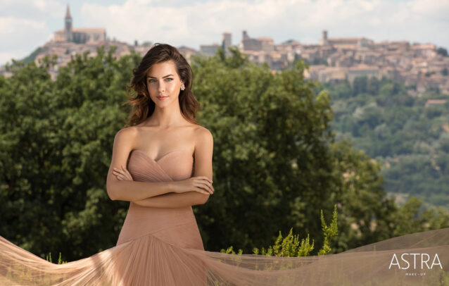 a girl with pink dress in an Italian landscape