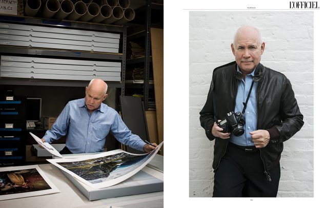 Steve McCurry with his camera posing for Officiel by Susi Belianska