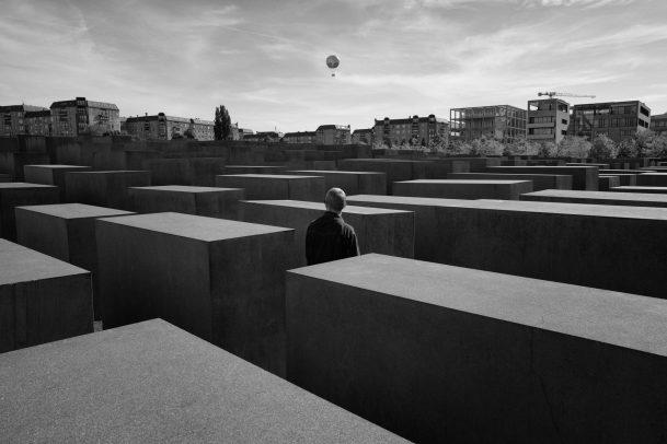 man in the Memorial to the Murdered Jews of Europe in Berlin