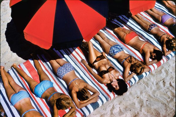 girls sunbathing on the beach