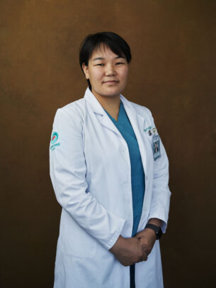 mongolian doctor posing for Novartis annual report by Joey L.