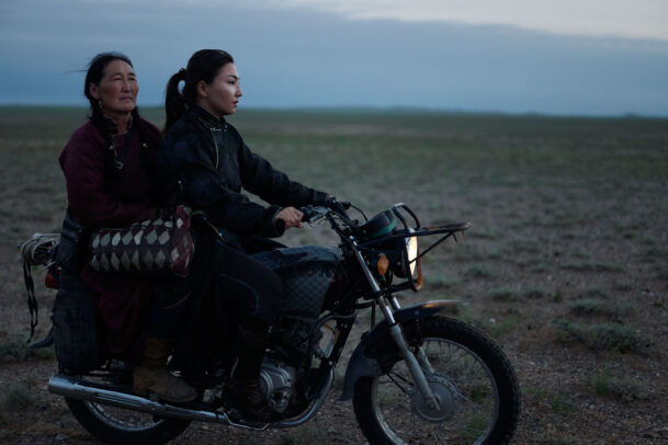 two women on a motorcycle in Mongolia