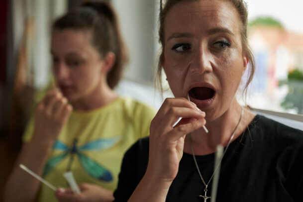 people with tampons in their mouths during Novartis annual report by Joey L.