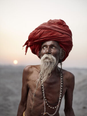 indian man with red turban and white long beard