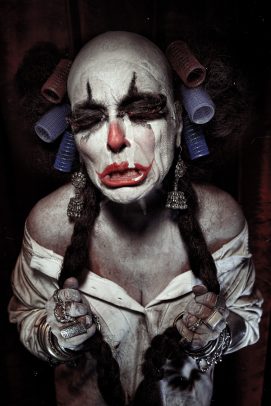 horror clown with curlers crying