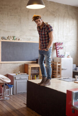 a male model with a checked shirt on a table