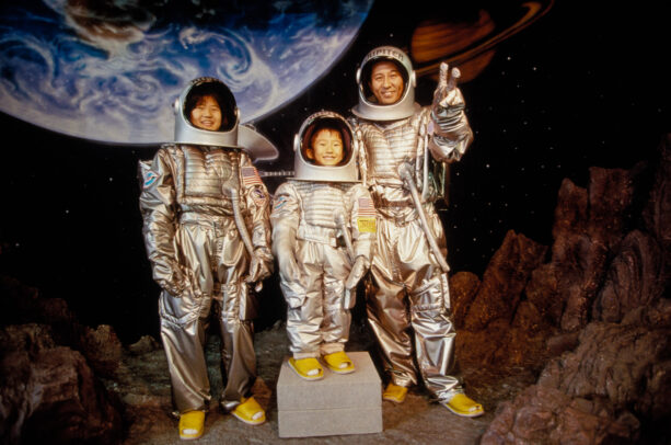 a japanese family posing in space suits