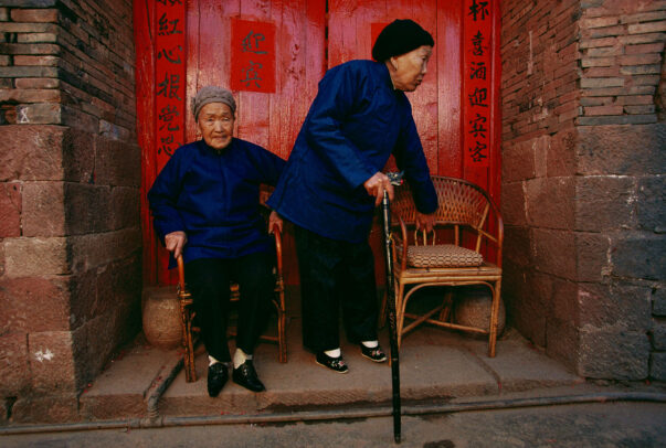 two old women with bended feet