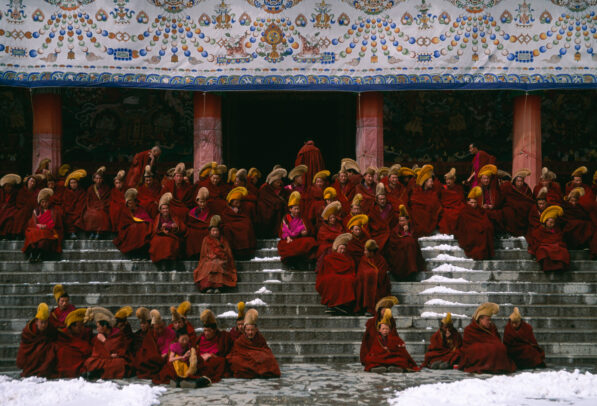monks on the stairs of a monastery