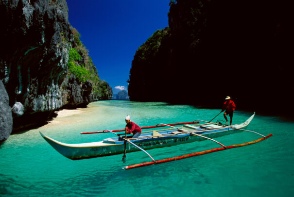 a boat in a crystalline beach of Philippines