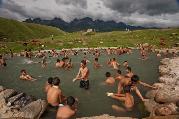 monks wash in a hot spring.